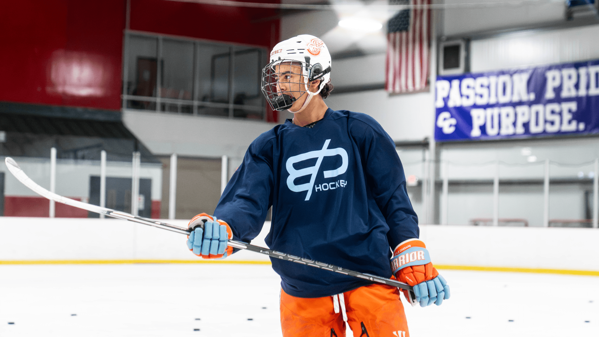 Coach on the synthetic ice training surface
