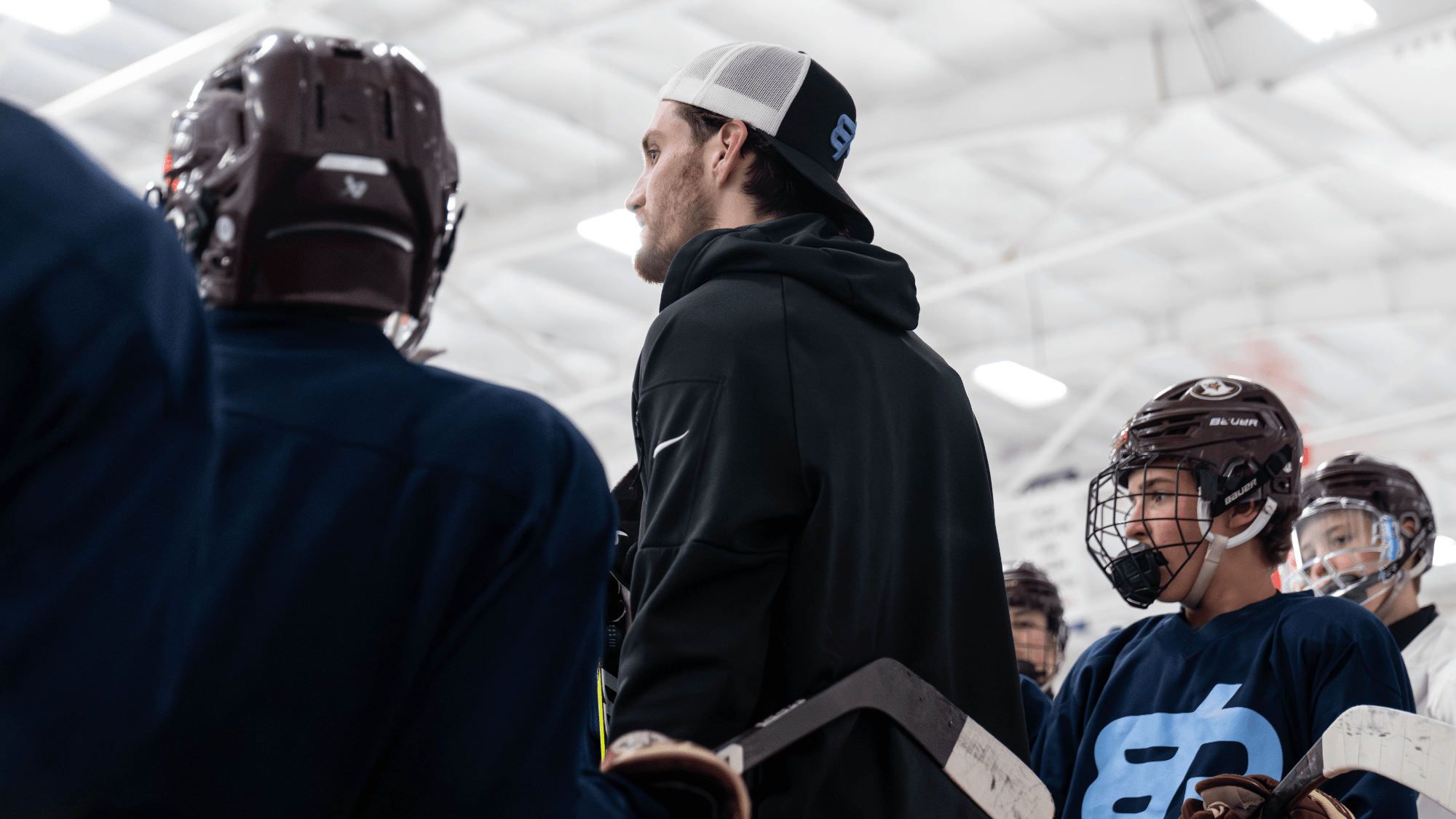 Coach reviewing play with players